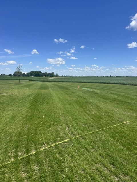 Mowed striped lawn on large rural acreage