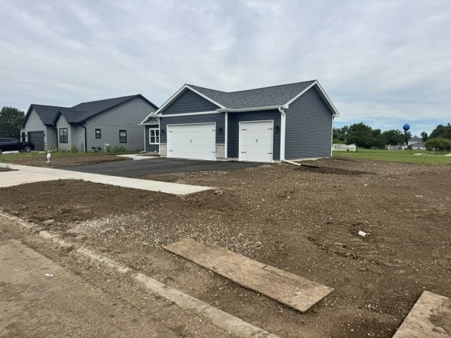 Bare graded soil at new-construction homes ready for seeding