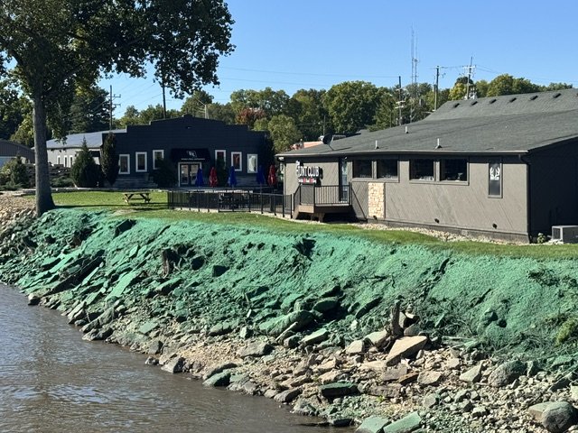 Hydroseeded rocky streambank along residential lots